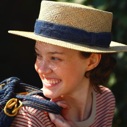 A woman picture from the Duolingo English Test image description task.